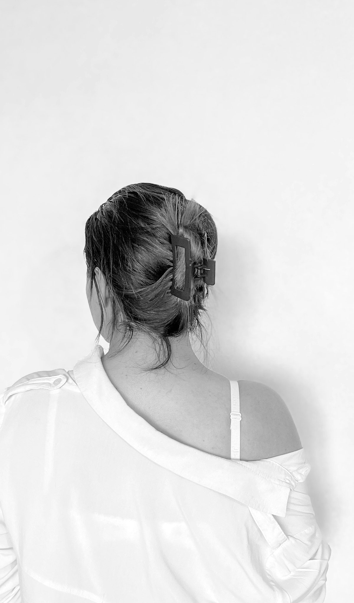 Hair secured with a clip, viewed from behind
